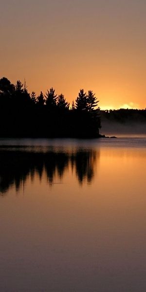 Tranquil Evening Sunset Wallpaper: Free Phone Background of Nature's Beauty