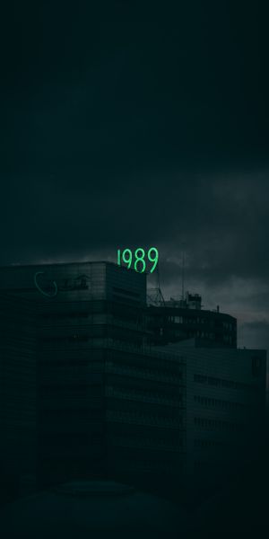 Dark Building with Illuminated 1989 Sign - Perfect Mobile Wallpaper