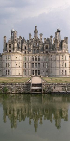 Majestic Castle Reflected in Serene Waters
