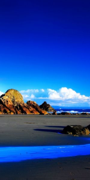Breathtaking Blue Beach Scenery with Ocean and Sky