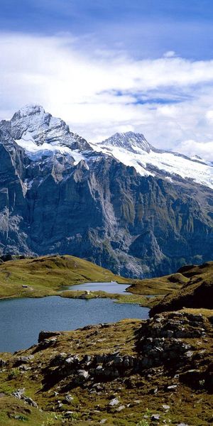 Phone wallpaper: Grass, Stones, Mountains, Lake, Nature, Switzerland free download