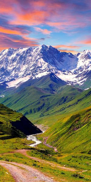 Breathtaking Sunset Over Mountain Valley with River Path