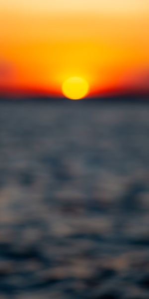 Beautiful Sunset Over the Smooth Sea Horizon