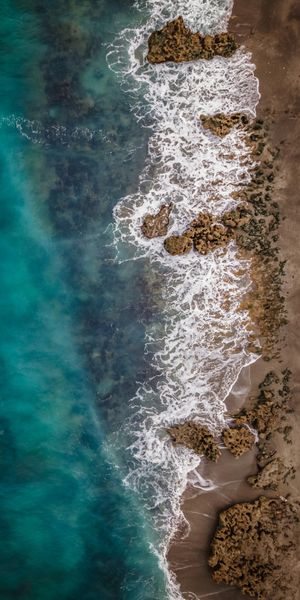 Aerial View of a Tranquil Beach with Turquoise Waters