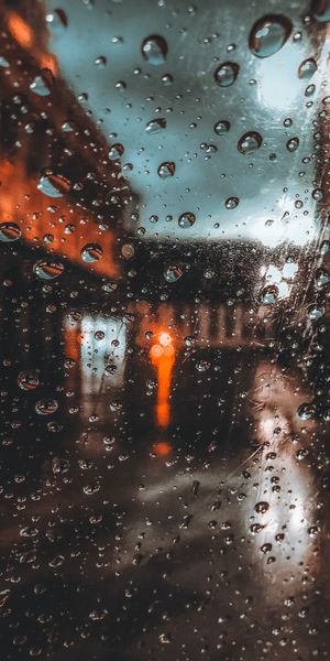 Rainy Cityscape with Macro Drops on Glass