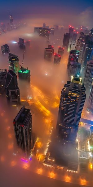 Aerial View of Dubai Skyscrapers in a Foggy Cityscape