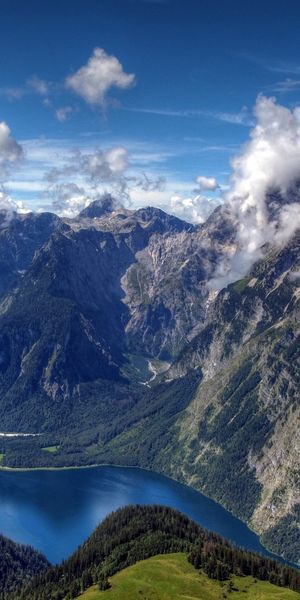 Breathtaking Mountain Landscape Featuring a River and Dramatic Clouds
