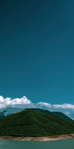 Breathtaking Island Landscape with Lush Hills and Clouds