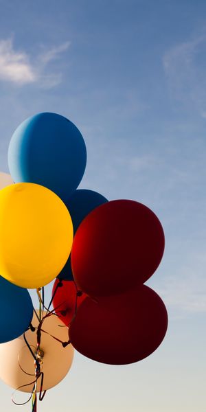 Multicolored Balloons Against a Bright Sky
