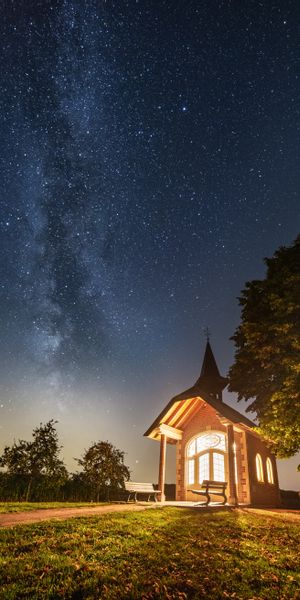 Charming Night Scene of a Building Beneath a Starry Sky
