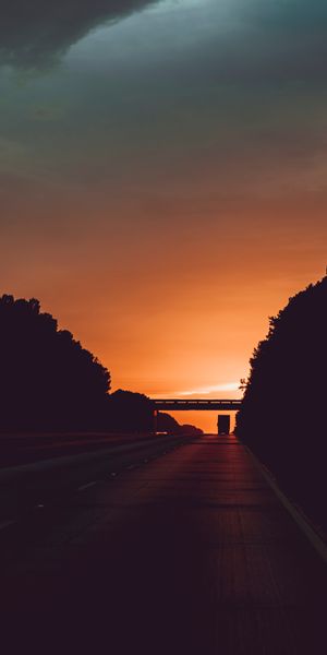 Twilight Sunset Over a Dark Road - A Captivating Mobile Wallpaper
