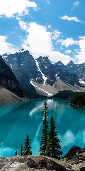 Breathtaking View of Snow-Covered Mountains and Tranquil Lake