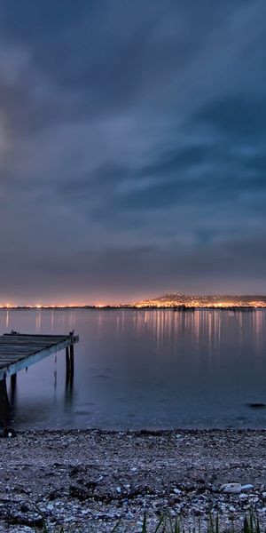 Moonlit Dock on a Tranquil Lake at Night
