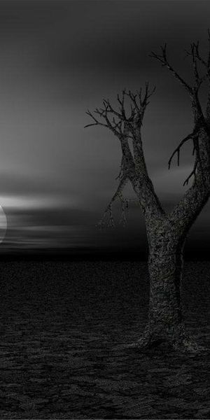 Eerie Dark Landscape with a Striking Tree Silhouette