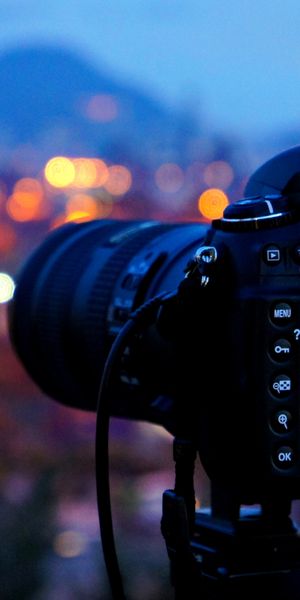 Nikon Camera with Bokeh City Lights - 4K Phone Wallpaper