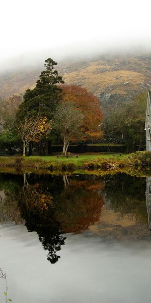 Tranquil church reflection on a foggy lake - HD iPhone wallpaper