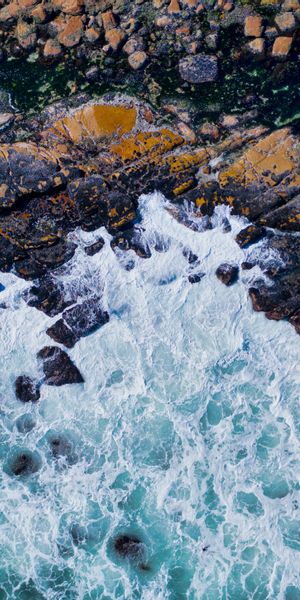 Majestic Ocean Waves Crashing on Rocky Shoreline