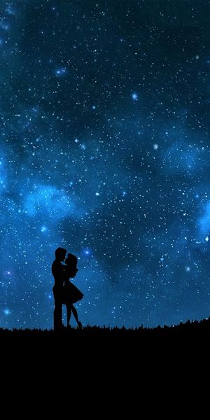 Romantic Blue Silhouette of a Couple Embracing Under a Starry Sky