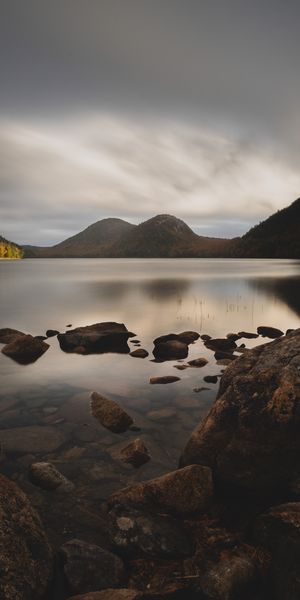 Tranquil Landscape Wallpaper: Mountains, Lake, and Rocks for Your Phone