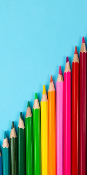 Vibrant Multicolored Pencils on a Blue Background
