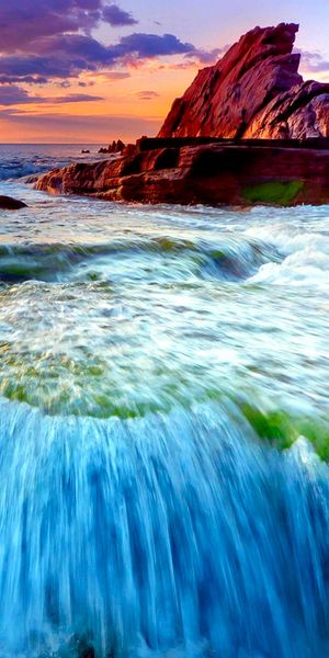 Breathtaking Sunset and Coastal Waterfall Wallpaper