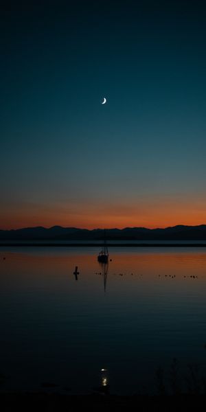 Beautiful Sunset with Sailboat - Ideal for Your Mobile Wallpaper