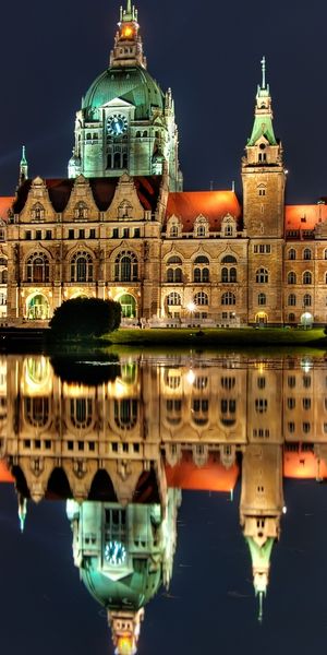 Majestic Night Landscape: Castles Reflected in Water - HD Phone Wallpaper