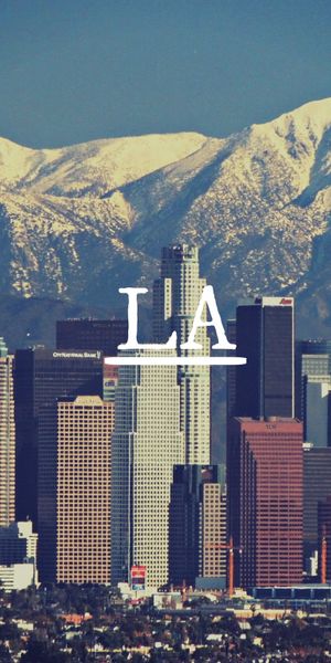 Breathtaking Los Angeles skyline with mountains - 4K phone wallpaper