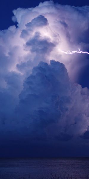 Mesmerizing Night Lightning Over the Ocean