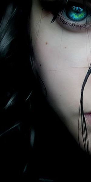 Mesmerizing HD wallpaper of a woman with dark hair and vivid blue eyes