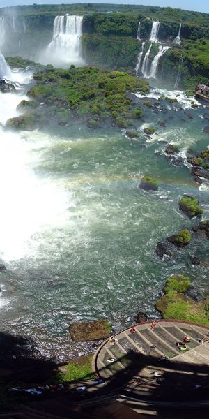 Breathtaking View of a Waterfall from Above with Lush Greenery