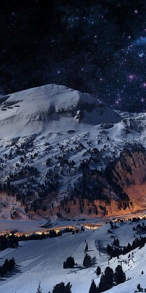 Serene Winter Landscape with Milky Way Over a Village