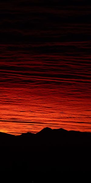 Breathtaking Sunset with Mountain Silhouettes