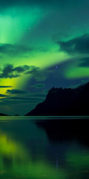 Mesmerizing Aurora Borealis Over Earth at Night
