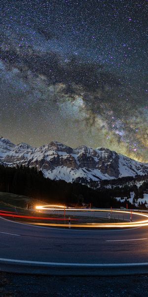 Breathtaking Mountain Road with Starry Sky Wallpaper