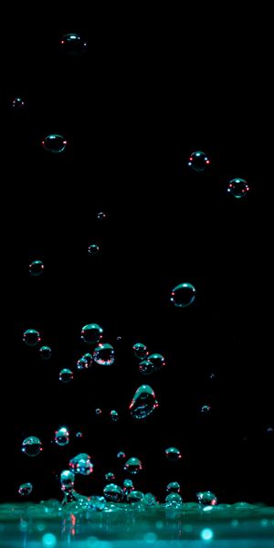 Macro Water Drops Splashing in Dark Background