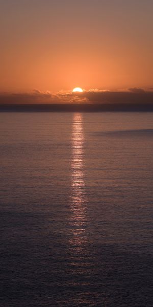 Breathtaking Sunset Over Water - Perfect Phone Wallpaper