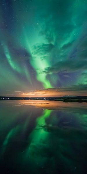 Breathtaking Aurora Borealis Reflecting in Night Waters