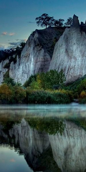 Breathtaking Cliff and Lake Reflection - Perfect iPhone Wallpaper