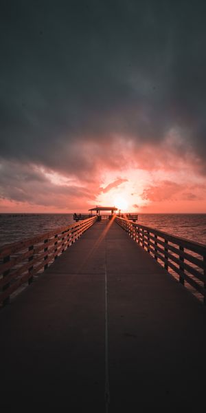 Breathtaking Sunset at the Pier with Overcast Sky