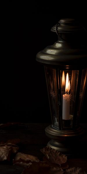 Cozy Candlelit Lantern in Dark Setting