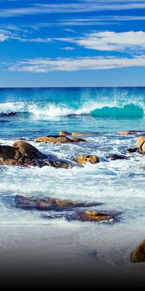 Beautiful Beach Scene with Vibrant Waves and Rocks