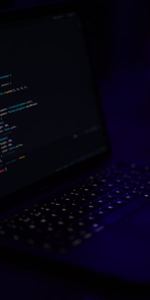 Dark Laptop Wallpaper Featuring Programming Code