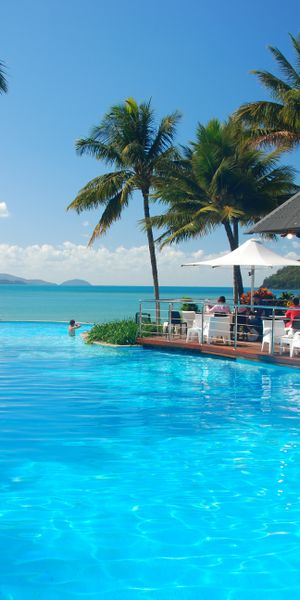 Tropical Poolside Wallpaper: A Serene Escape to Nature and Sea