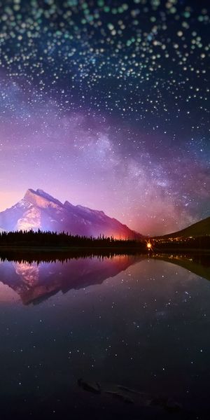 Breathtaking Reflection of a Starry Sky Over a Mountain Lake