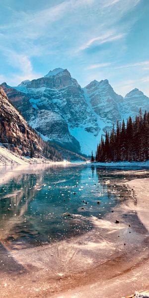 Breathtaking Winter Landscape with Mountains and a Serene Lake