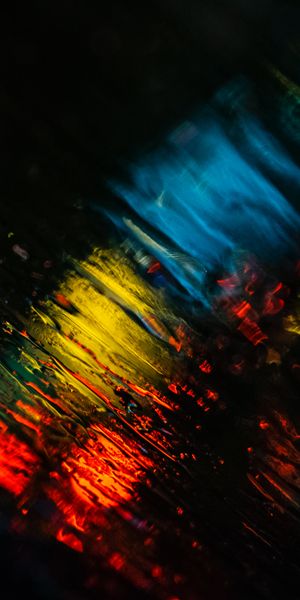 Free mobile wallpaper featuring colorful blurred lights and rain effects