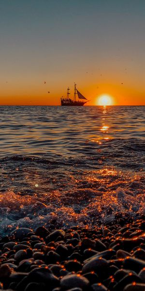 Breathtaking Sunset at the Shore with a Ship