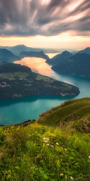Majestic 4K Wallpaper of the Alps: River, Mountains, and Horizon