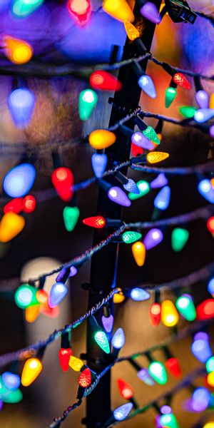 Vibrant Multicolored Garland Lights Wallpaper
